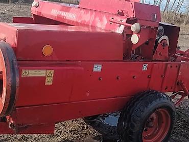 Тюковые пресс-подборщики: Пресс-подборщик тюковый UNIA-FAMAROL (польский) - Тип — 11