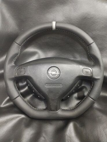 Auto delovi, gume i tjuning: Auto tapetarija KG design Na prodaju modificovani volani za Opel