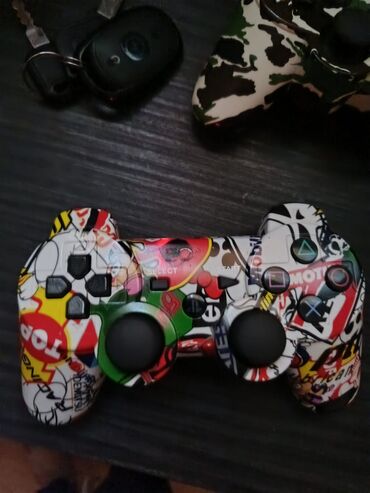 PS3 (Sony PlayStation 3): Sony PlayStation 3 Super Slim konzola (top‑loader) sa kamuflažnim — 5