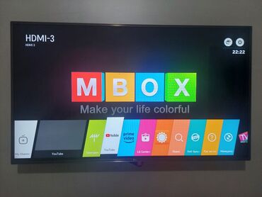 Televizorlar: MBOX açılış ekranı göstərilən smart televizor. Ekranın yuxarı