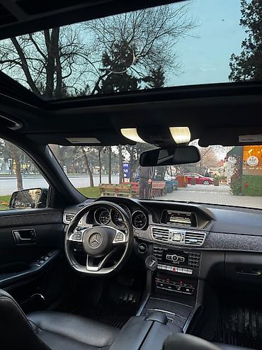 mersedes guzgu: Mercedes-Benz E‑Class sedan – AMG paketli, qara rəngdə. Əsas — 8
