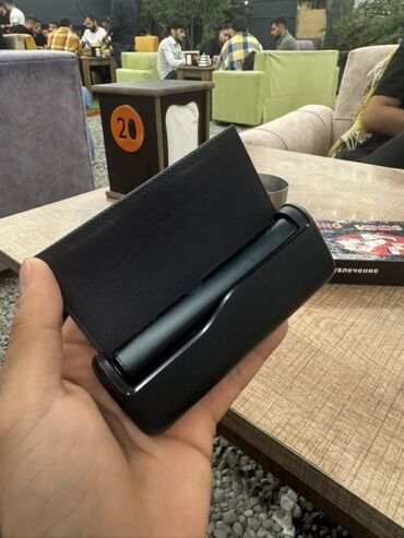 Iqos Illuma Prime Bu, tutmaq üçün nəzərdə tutulmuş, qara rəngli