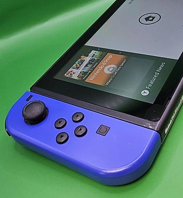 Nintendo Switch: Игровая консоль Nintendo Switch с разноцветными Joy‑Con (левый — — 8