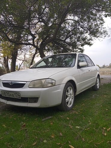 машина гест: Mazda Familia: 1999 г., 1.4 л, Автомат, Газ, Седан