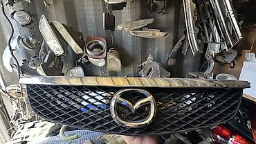 значок мазда: Решётка радиатора Mazda f323 - Оригинальная передняя решётка — 1
