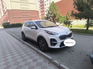 спринтер на продажу: Белый кроссовер Kia Sportage с динамичным внешним видом и современным