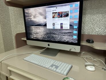 hard disk qiymətləri: Apple şirkətinin istehsalı olan iMac kompüteri. Gümüşü rəngdədir. Ofis