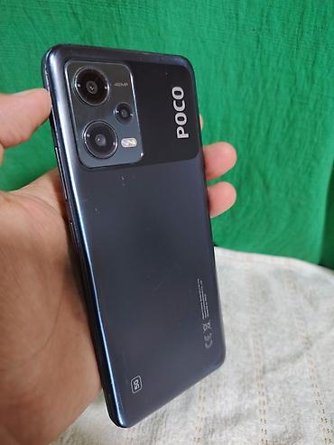 poco f8 pro max: Смартфон POCO X5 5G в тёмном цвете. Характеристики по фото: - модель — 1