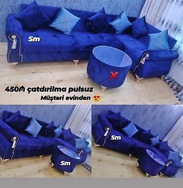 Mavi rəngdə dəriyəoxşar parça ilə çəkilmiş künc divan dəsti. Klassik