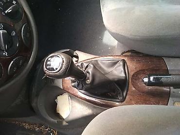 sticha: MAHAGONI SREDNJA KONZOLA GHIA ZA FORD FOCUS OD 1998. DO 2004. GOD. | — 1