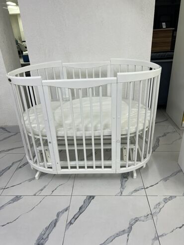 шкаф для кухни напольный: Круглая детская кроватка Comfort Baby белого цвета. Конструкция из