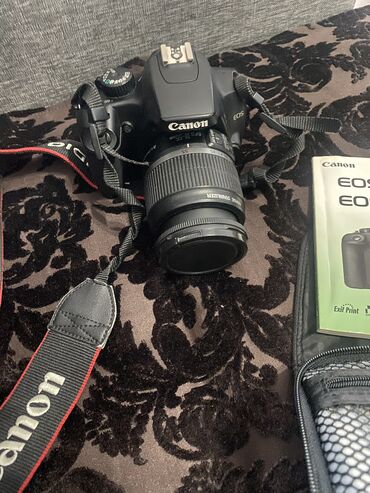 Продаю фотоаппарат Производство Япония Canon EOS 1000D Есть штатив