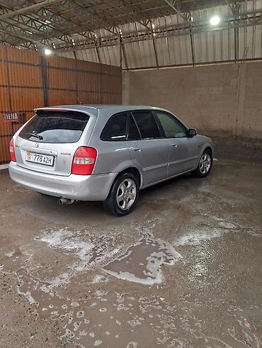 х5 м: Mazda Familia: 2001 г., Бензин, Универсал — 4