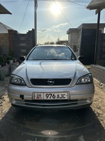 купить бокс на крышу автомобиля бу: Универсал Opel Astra G серебристого цвета, оснащенный багажными