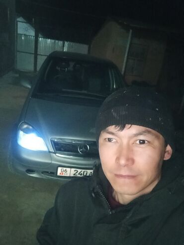 эбу нексия 2: Автомобиль хэтчбек серого цвета с правым рулем. Передняя оптика с