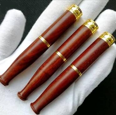 Зажигалки: Элегантный мундштук для сигарет, выполненный в темных тонах, с — 3