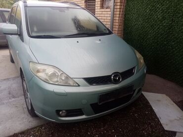 teretne gume 14 c: Porodični automobil Mazda 5, minivan svetlozelene boje, nudi prostranu