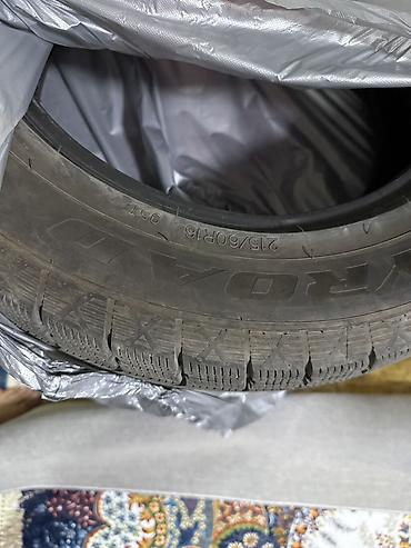 моно 1 6: Зимняя шина Toyo 215/60 R16 95T. На боковине видны: - размер: 215/60 — 3