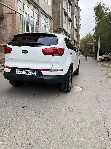 su radiatoru: Kia Sportage, ağ rəng, kompakt krossover. Güclü və qənaətcil — 6