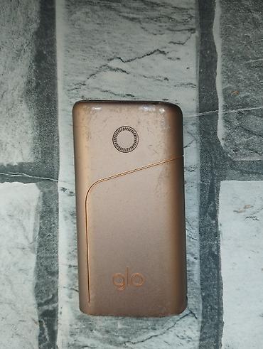 smart saat adapteri: Glo tütün qızdırıcı cihaz - Brend/model: glo (üzərində “glo” loqosu) — 2