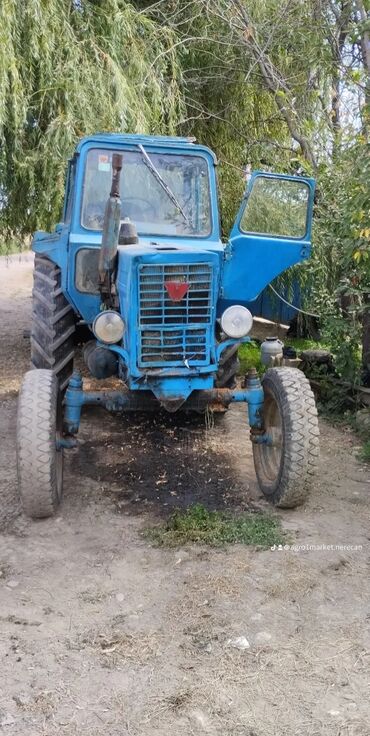 Traktorlar: Mtz 80 yalnız dermanda isleyib teze tekerler ustunde bir ipe xoddanan