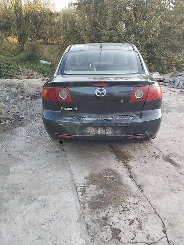 Mazda: Mazda 3, седан (поколение BK). Цвет темно‑серый/черный. Бензин автомат — 1
