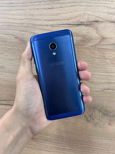 Смартфон Alcatel 5009D в синем цвете. Основные характеристики: -