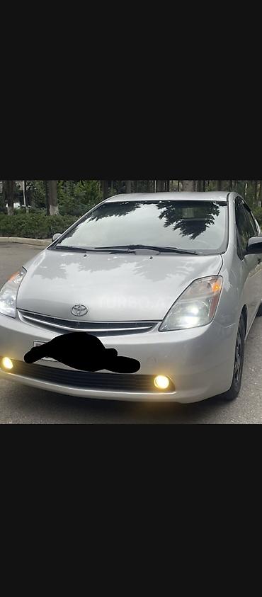 panorama 2008: Toyota Prius (2-ci nəsil, liftback, gümüşü rəng) gündəliy icarəyə — 5