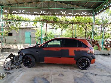 dizel generator qiymetleri: Kia Rio hatchback (CRDI, Sport paket yazıları ilə). Narıncı-qara iki — 1
