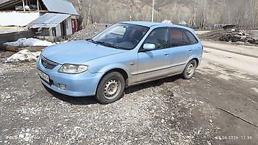 Унаа: Mazda 323: 2002 г., 1.6 л, Кол менен иштөөчү, Бензин, Универсал — 5