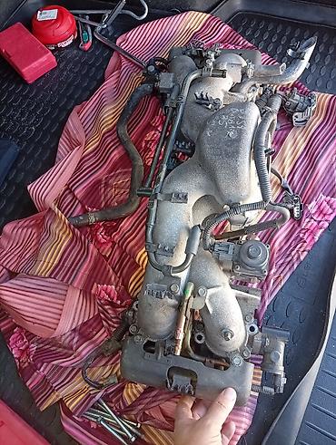 Коллекторы: Впускной коллектор в сборе для Subaru. Описание: - Оригинальный — 3