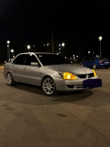 зима лета: Mitsubishi Lancer: 2004 г., 1.6 л, Механика, Бензин, Седан