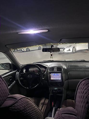 mazda 323 машина: Mazda 323: 2003 г., 1.6 л, Автомат, Бензин, Хэтчбэк — 9