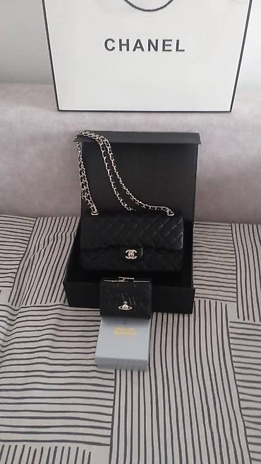 burker часы: Сумка Chanel Classic Flap, черная, кожа, стеганый кварцеобразный — 2