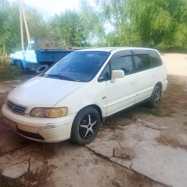 дэу матиз бу бишкек: Белый минивэн Honda Odyssey с характерным дизайном кузова, включающим