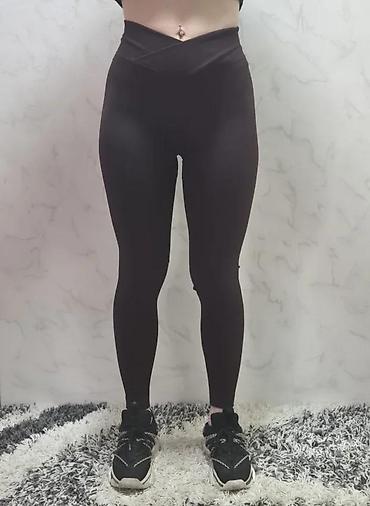 Helanke, biciklistički šortsevi: Ženske helanke tamne boje sa rebrastom teksturom. Karakteriše ih visok — 2