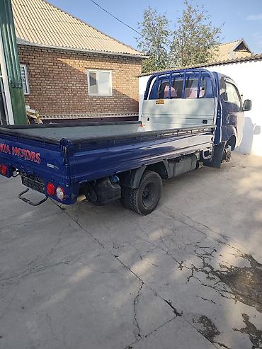 борта: KIA Bongo (K2500/K2700) бортовой малотоннажный грузовик, синий цвет — 5