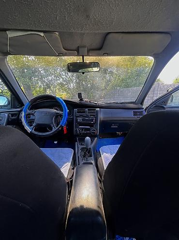 byd e6: Toyota Carina E: 1998 г., 1.6 л, Механика, Бензин, Хэтчбэк — 10