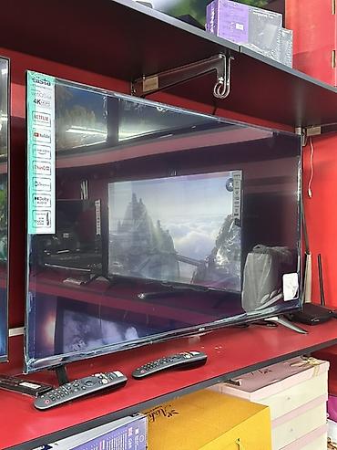 Смарт‑телевизор LG с webOS, диагональ около 55–60". Разрешение 4K UHD