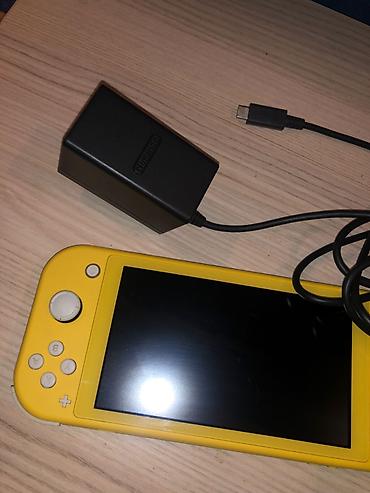 nintendo lite: Nintendo Switch Lite (Yellow) + Original Adapter Vəziyyəti: Yaxşı — 2