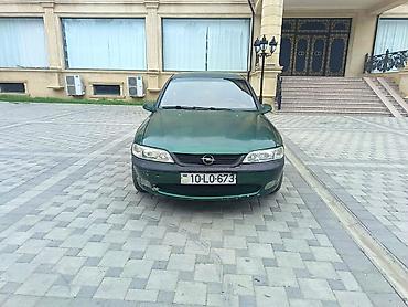 kredit avtomobil: Opel Vectra sedan – tünd yaşıl rəng, 4 qapı, 5 yerlik. Şəhər və tras — 3