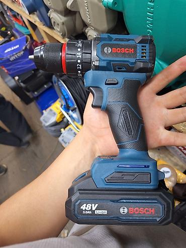 Ударные дрели: Аккумуляторная дрель-шуруповерт Bosch в синем корпусе с черными — 2