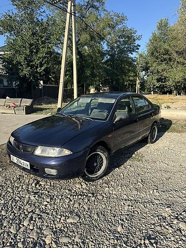 Унаа: Mitsubishi Carisma: 1998 г., 1.6 л, Кол менен иштөөчү, Бензин, Седан — 1