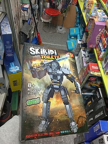 золотое: Конструктор Skibidi Toilet – Assassin Electric Drill Man - Набор для — 1