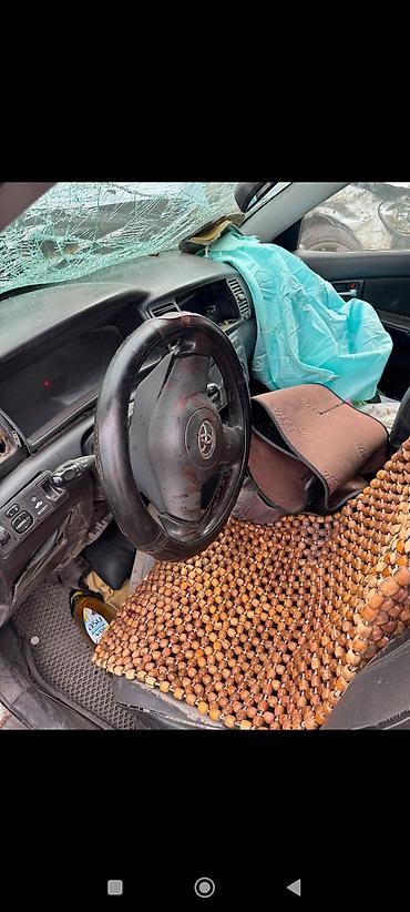 ось: Toyota Corolla E120 2006 голубой. Автомобиль после сильного — 3