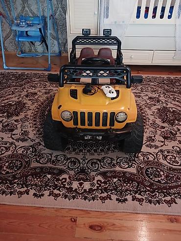 plaslar kisi: Uşaq elektrik avtomobili – sarı of-road jeep tipli model — 2
