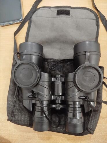 Binokllar: Binokl – klassik Porro prizmalı, geniş obyektivli model. Mədədə — 9