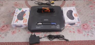 mega llc: Sega Mega Drive 2 oyun konsolu, daxil edilmiş Mortal Kombat kartricası
