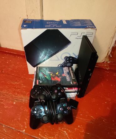 сколько стоит playstation 2: Salam PlayStation2 slim satilir.Yaninda 30 oyun diski ile 50