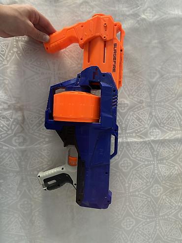 купить нерф: Игровой бластер Nerf SurgeFire с барабанным магазином. - Серия — 1